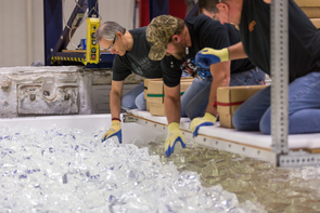 Mirror Lab staff place the final layer of glass into the mold for GMT mirror 5. From left: Randy Lutz, Britt Kayner and John Martin. (Photo: Giant Magellan Telescope – GMTO Corp.) Mirror Lab staff place the final layer of glass into the mold for GMT mirror 5. From left: Randy Lutz, Britt Kayner and John Martin. (Photo: Giant Magellan Telescope – GMTO Corp.)